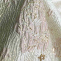 Tessuto jacquard damascato in raso di seta rosa